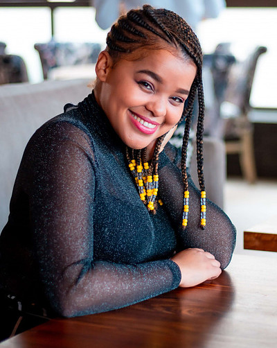 smiling woman sitting at table