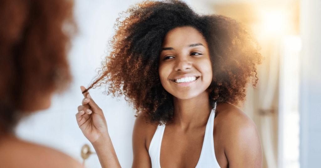 black woman pulling natural hair